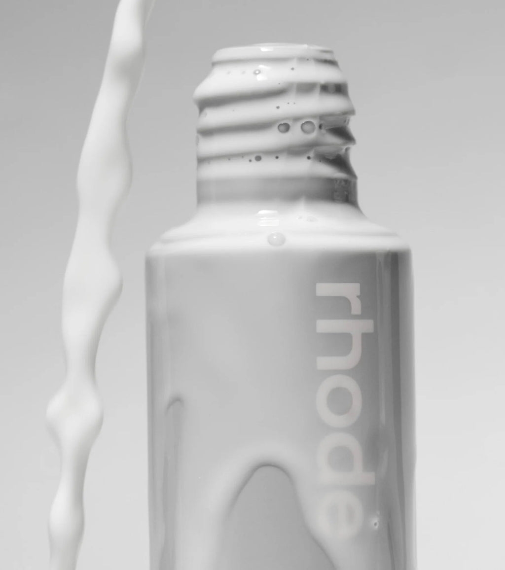 Rhode Glazing Milk close-up product shot with milk splash