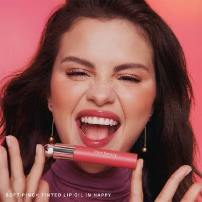 Rare Beauty Soft Pinch Tinted Lip Oil - model wearing Happy shade