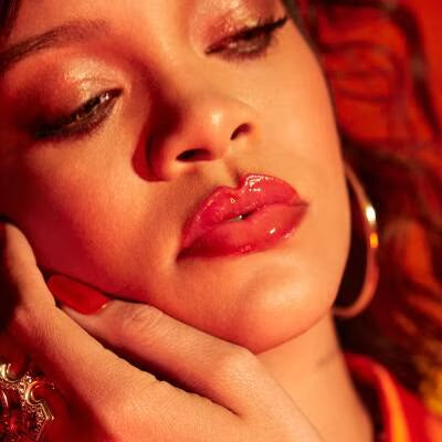 Model wearing Fenty Beauty Gloss Bomb Heat in Hot Cherry