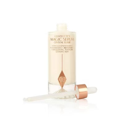 Charlotte's Magic Serum Crystal Elixir bottle lying down with dropper